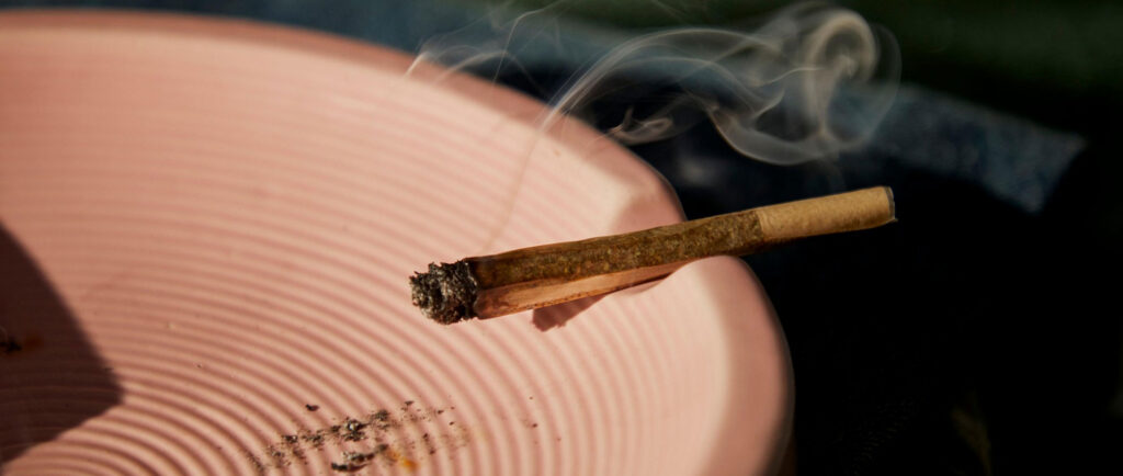 Cannabis pre-roll in a pink bowl